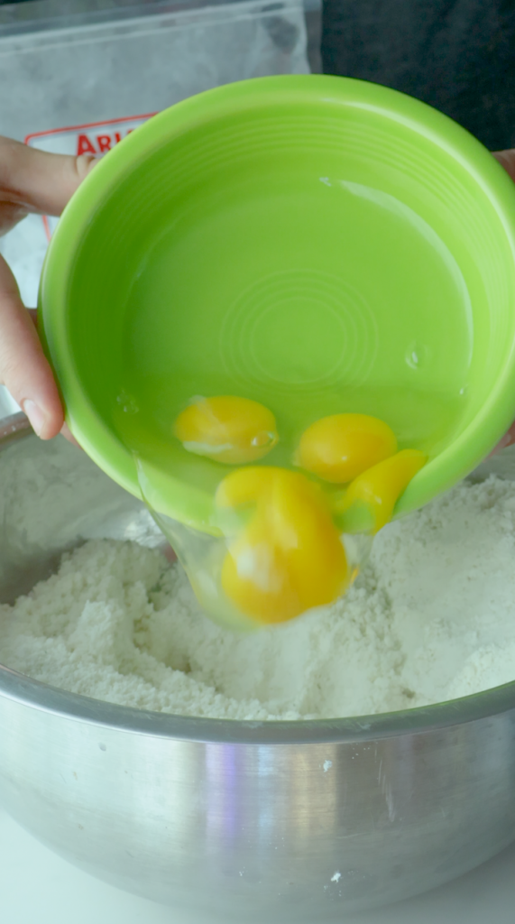 2. Then add oil. Gradually add eggs to mixture until desired color and consistency is achieved. 